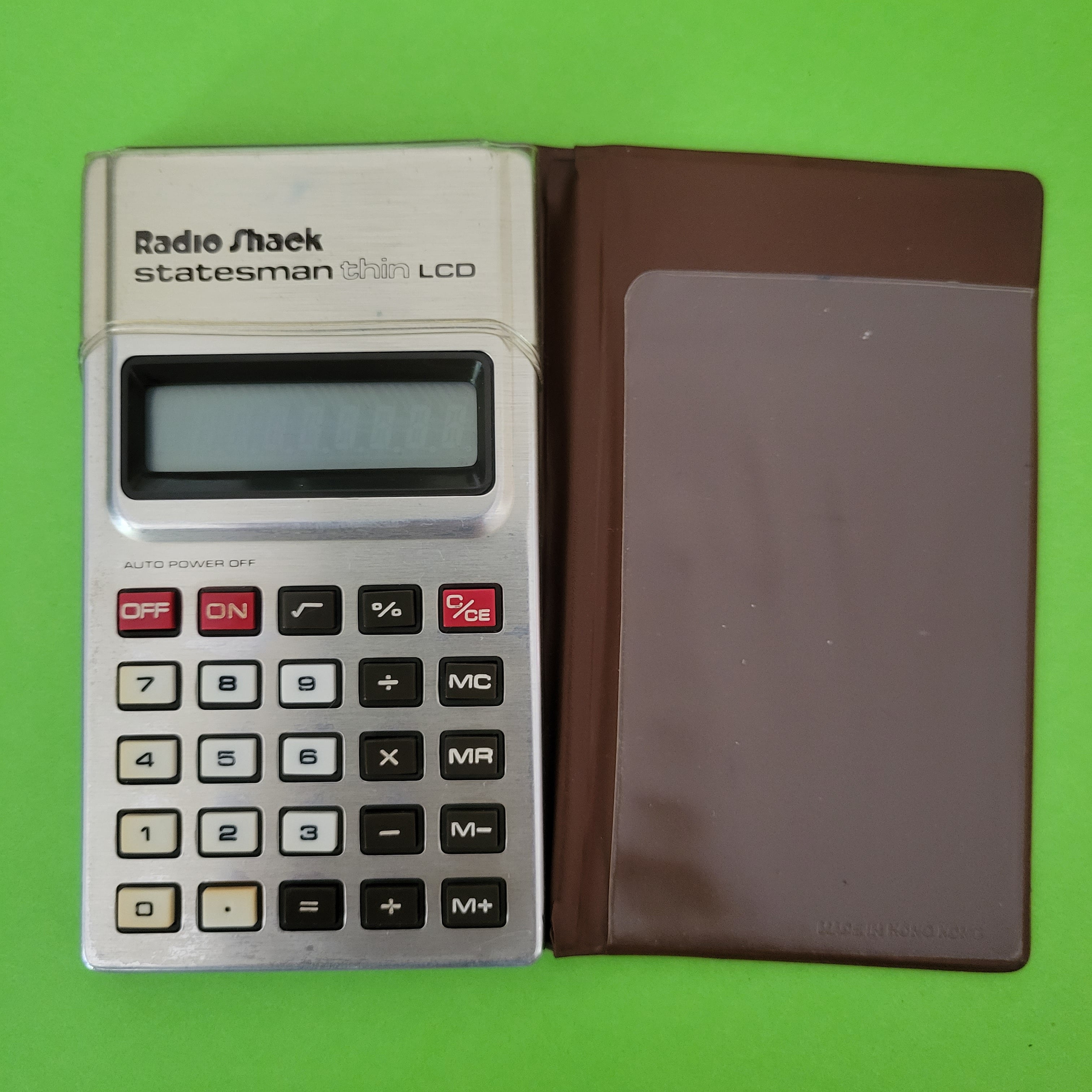 an image of a Radio Shack Statesman thin LCD Four Function + calculator
